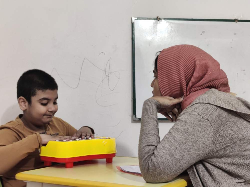A therapist and child in a one-to-one session